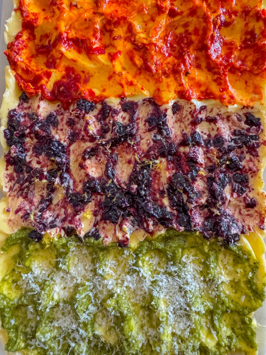 an overhead view of a butter board with colorful toppings. 