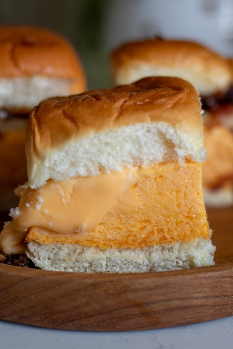a fluffy eggbite  sandwich with american cheese on kings hawaiian rolls. 