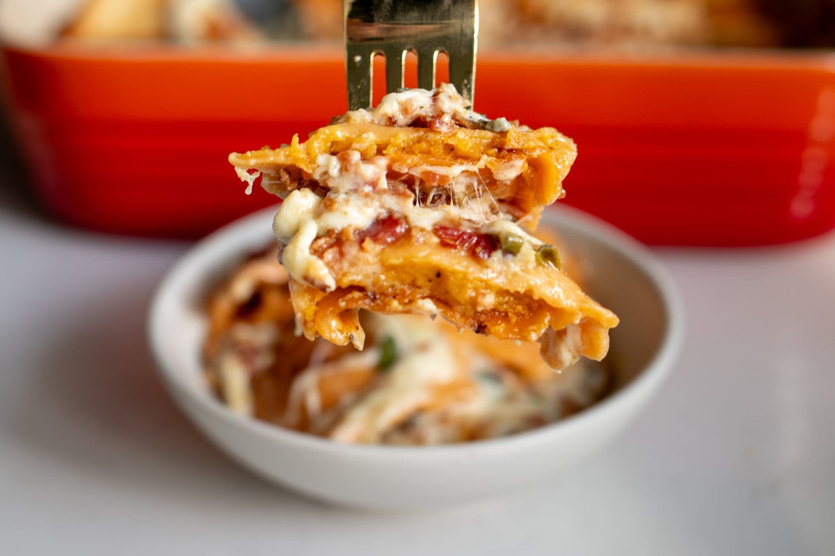 a fork holding a scoop of this butternut squash lasagna recipe.
