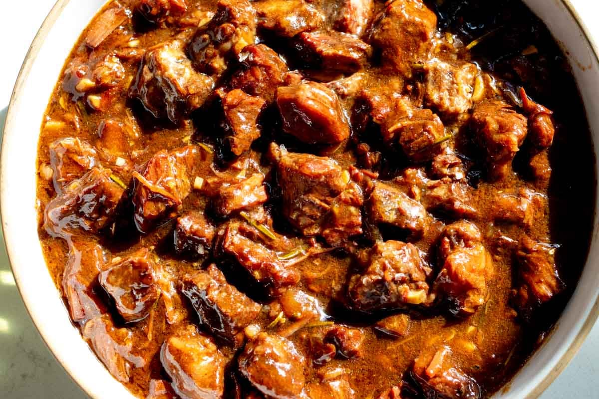 an up close look at the texture of some super tender garlic steak bites that were made in the crockpot.
