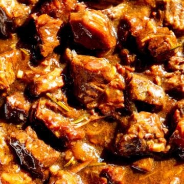 an up close look at the texture of some super tender garlic steak bites that were made in the crockpot.