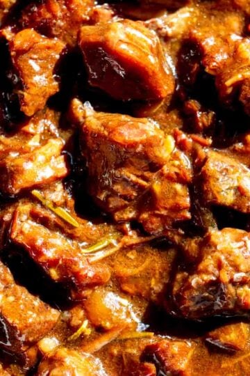 an up close look at the texture of some super tender garlic steak bites that were made in the crockpot.