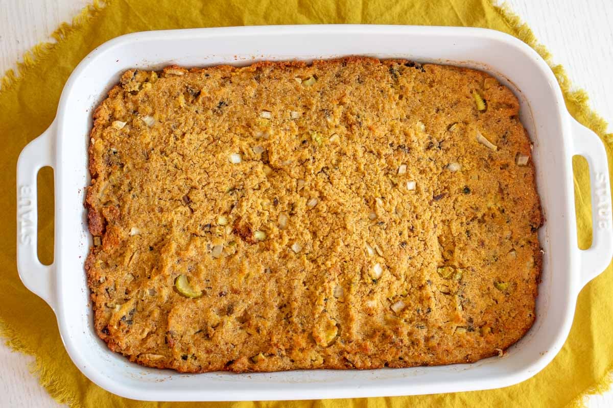 a big white baking dish full of golden oyster dressing.