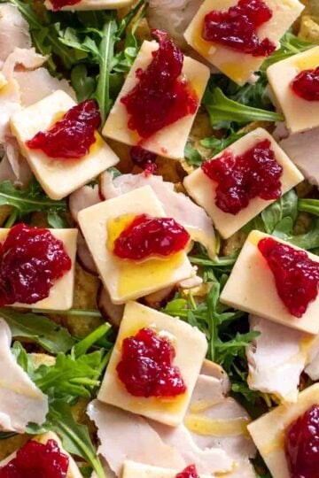 a plate of turkey cranberry and cheese charcuterie chips.