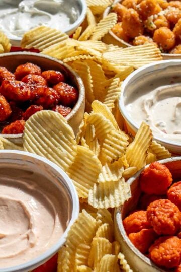 a saucy nugget platter with heluvagood dips and ridged potato chips.