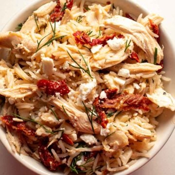 a bow lf chicken and rice with sun dried tomatoes, feta, lemon and dill using the viral shaken chicken approach.