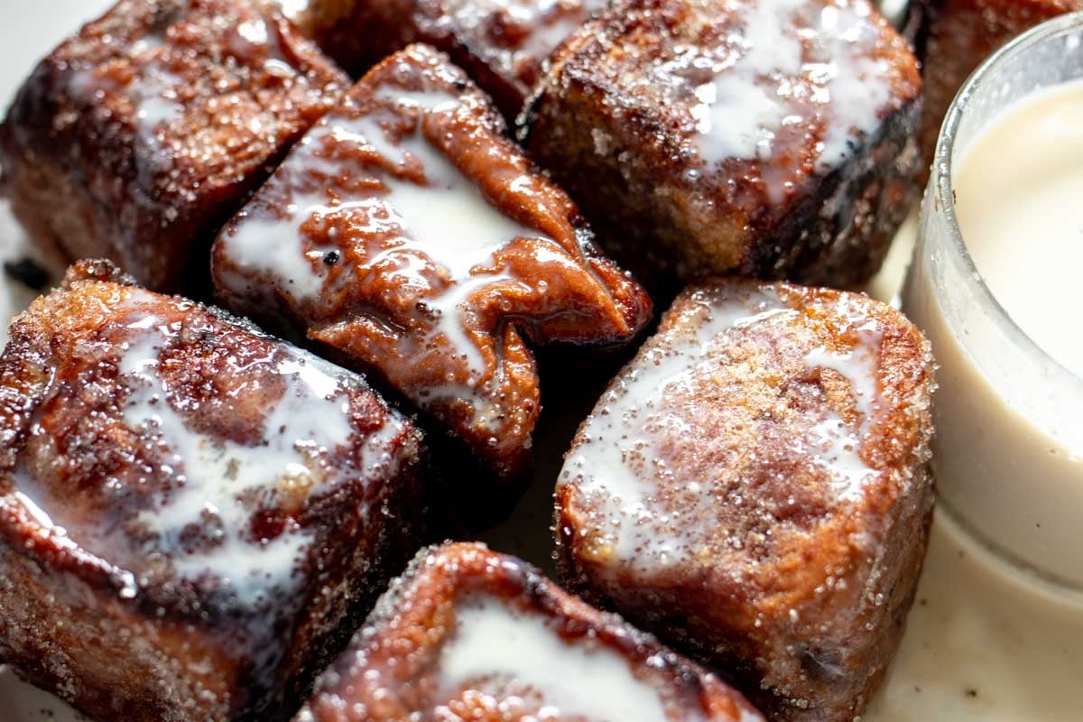 tres leches mixture poured over french toast bites.