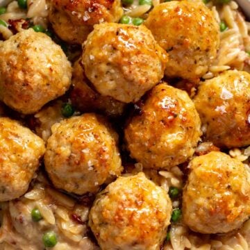 a close up of ground chicken meatballs with a hot honey glaze.