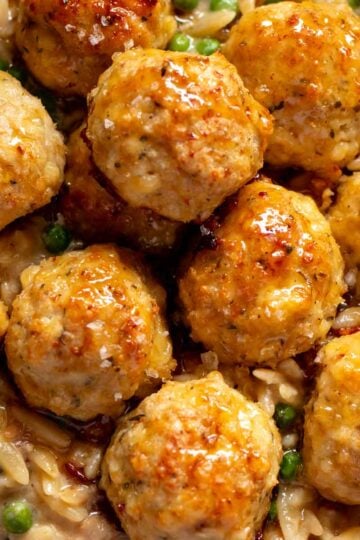 a close up of ground chicken meatballs with a hot honey glaze.