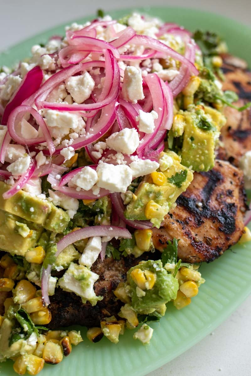 an up close look at the ingredients on top of the grilled chicken.