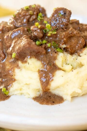 tender bites of steak in an au poivre sauce over mashed potatoes.