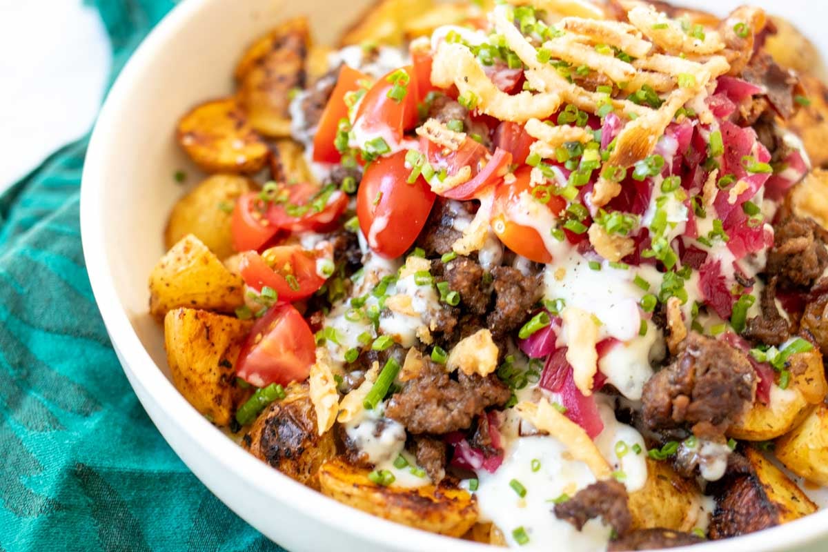 a close up of the toppings on this burger bowl.