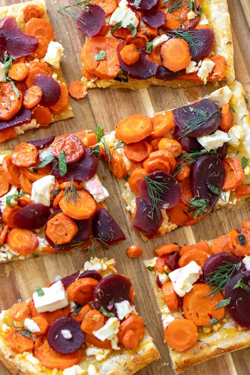 a few pieces of this cut carrot tart with feta, pickled beets and herbs.